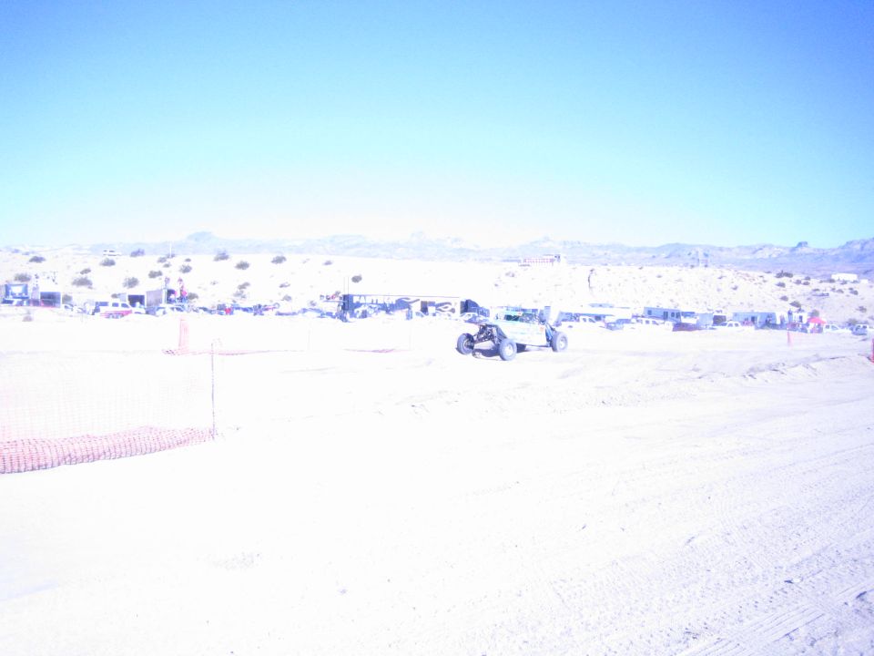 Off-road buggy on a bright sandy desert race course