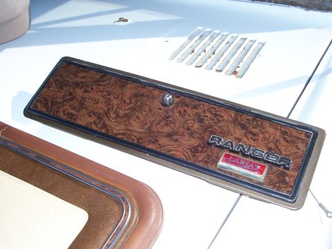 1978 Ford Bronco - This woodgrain trim panel features the RANGER emblem, likely from an interior or exterior application.