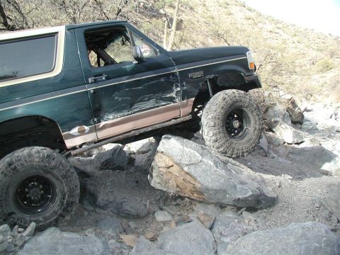 1994 Ford Bronco - This 1994 Ford Bronco is shown off-roading through a rocky landscape.