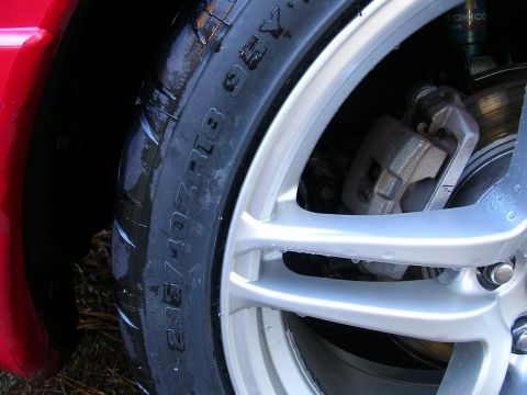 1996 Ford Probe - Close-up of a car wheel and tire, showing the tire size 235/40ZR18.