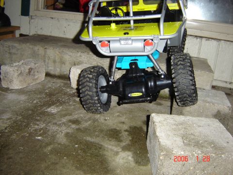 1993 Ford Bronco - This remote control rock crawler toy is shown navigating a series of concrete blocks.