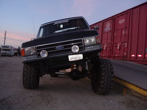 1989 Ford Bronco - This lifted Ford truck appears to be from the late 1980s, possibly a 1987 model, with its distinctive grille and body style.