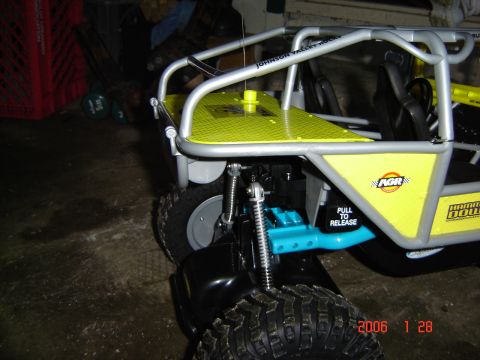 1993 Ford Bronco - Close-up of a remote control rock crawler toy, showing its suspension and body details.