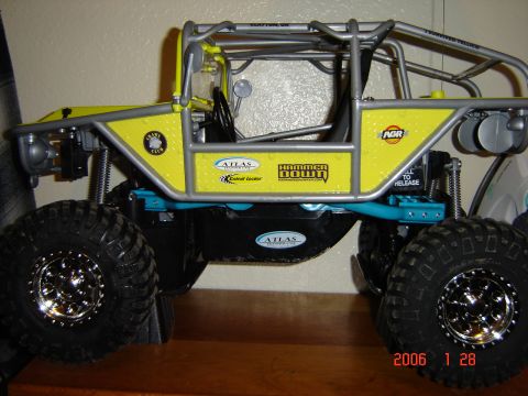1993 Ford Bronco - This yellow off-road RC car features a prominent roll cage and large, tires, suggesting it is designed for extreme terrain.