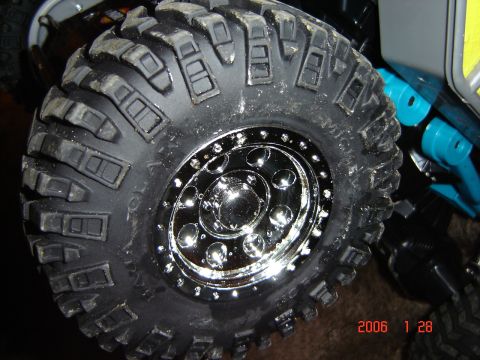 1993 Ford Bronco - Close-up of an off-road tire and chrome wheel, with a date stamp of 2006.