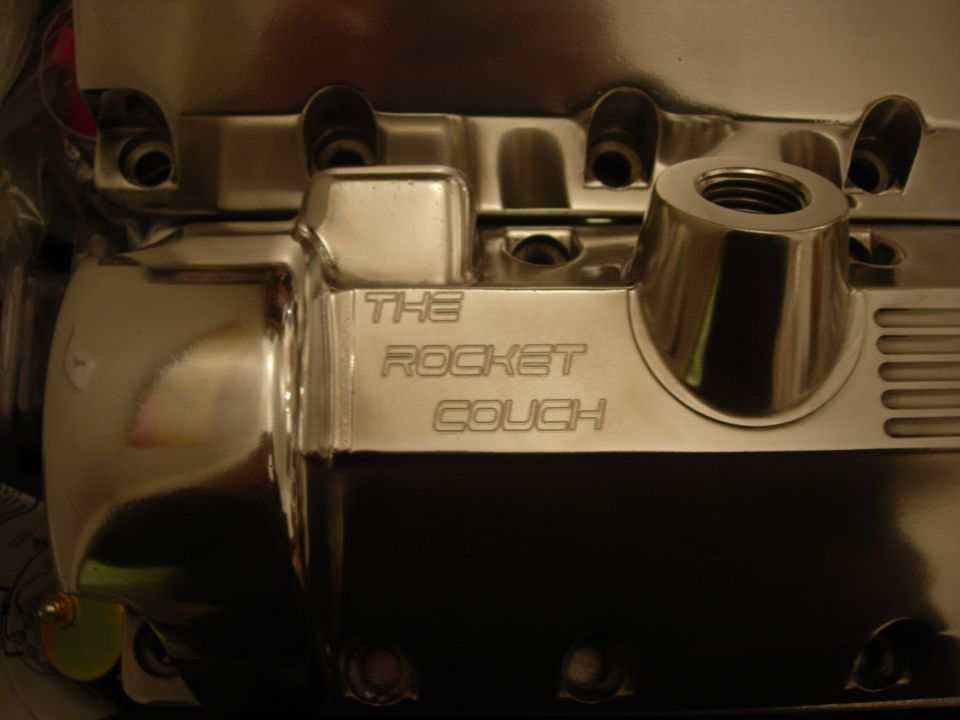 Polished aluminum intake manifold engraved "The Rocket Couch"