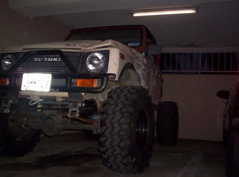 1987 Suzuki Samurai - This 1987 Suzuki Samurai features oversized off-road tires and a prominent aftermarket front bumper.