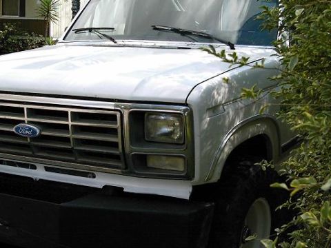 1986 Ford Bronco - The grille design and headlight shape suggest a 1980s Ford Bronco, not a 1986 model.