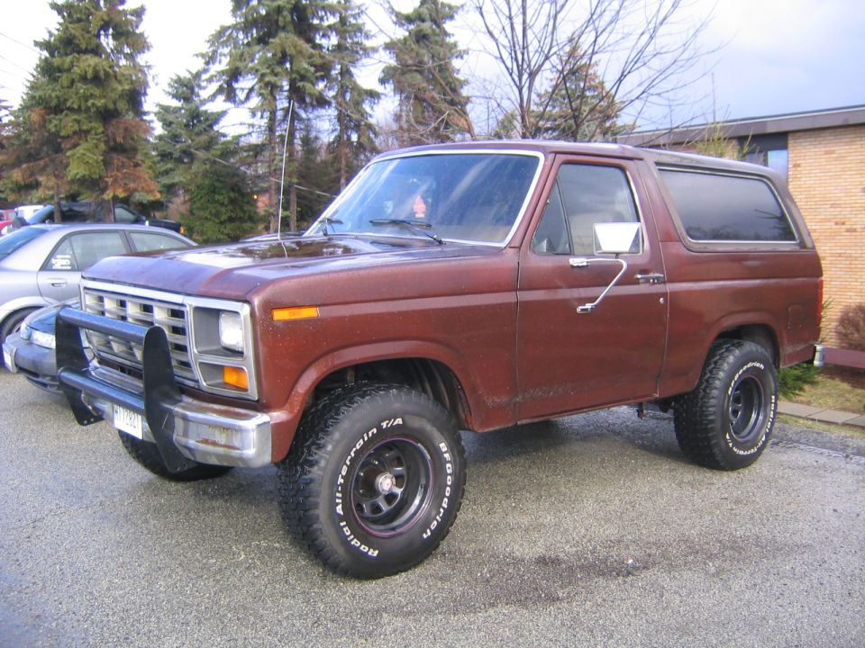 1978 Ford Bronco with bull bar and BFGoodrich tires parked on asphalt