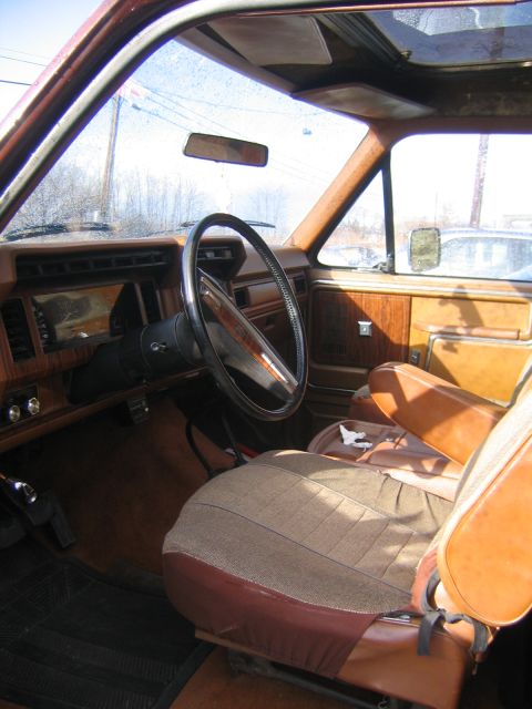 1978 Ford Bronco - The interior of a 1978 Ford Bronco shows its distinctive cloth and leather seats and wood-grain trim.