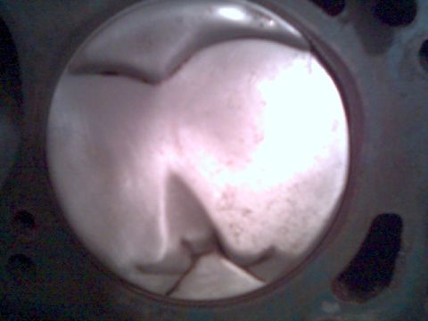 1972 Ford Ranchero - Close-up view of a piston within an engine cylinder, revealing internal engine components.