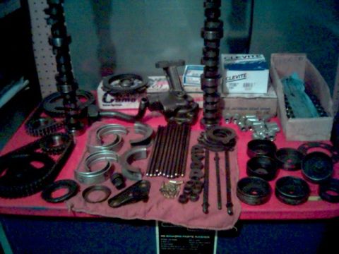 1972 Ford Ranchero - Various engine components, such as camshafts, bearings, and an oil pump, are displayed on a red cloth.