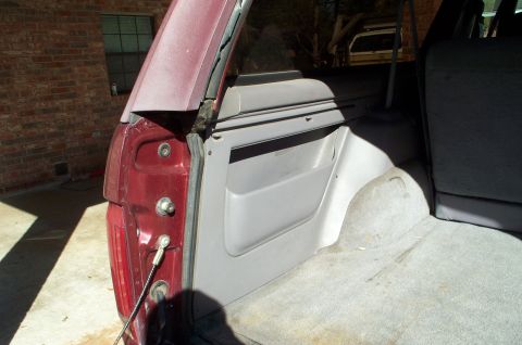 1996 Ford Bronco - Interior view of the cargo area in a 1996 Ford Bronco, with a second vehicle in the background.