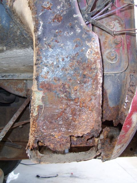1978 Ford Bronco - Close-up view of severely corroded vehicle frame components, showing extensive rust damage.
