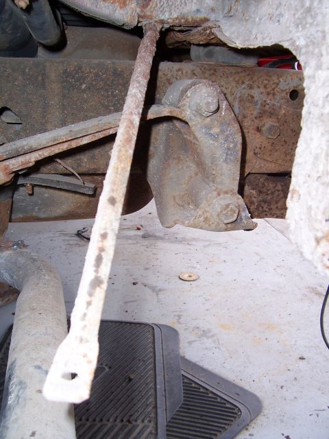 1978 Ford Bronco - Close-up of heavily rusted suspension or frame components on a vehicle.