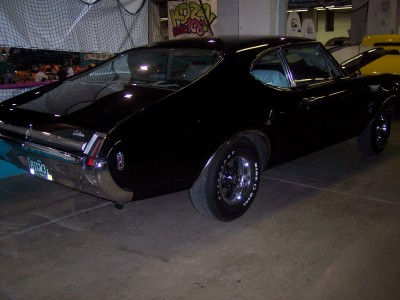 1972 Ford Ranchero - Rear view of a black coupe, likely from the early 1970s, with distinctive chrome trim.
