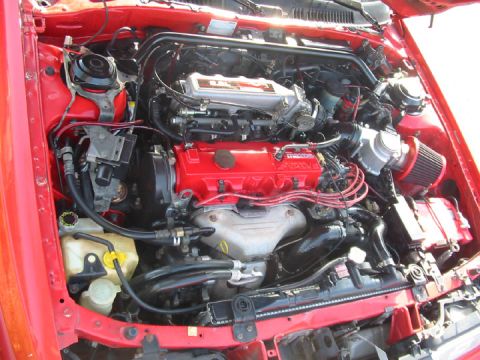 1989 Mazda MX-6 - Engine bay of a Mazda V6, showing various components and wiring.