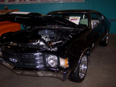 1972 Ford Ranchero - This black Chevrolet SS, likely from the early 1970s, is displayed with its hood open, revealing a powerful engine.