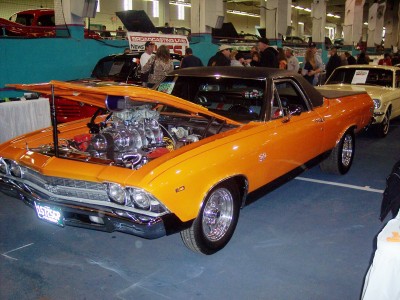 1972 Ford Ranchero - Custom pickup truck with a powerful V8 engine on display at an indoor event.