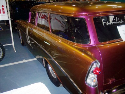 1972 Ford Ranchero - A customized station wagon with a unique two-tone paint job is displayed indoors.
