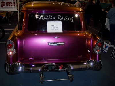 1972 Ford Ranchero - Rear view of a custom purple station wagon with 'Familia Racing' decal and a 'Please Do Not Touch' sign.
