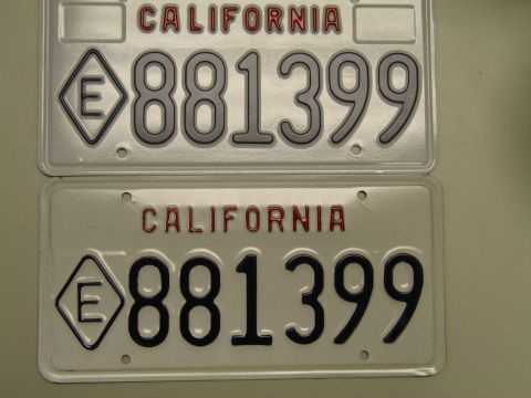 1991 Ford LTD Crown Victoria - Two white California license plates reading 881399 with the E-in-diamond emblem, shown stacked on a surface.
