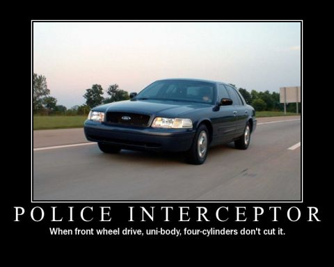 1998 Ford Crown Victoria - This 1998 Ford Crown Victoria Police Interceptor is shown from a 3/4 front view on a highway.