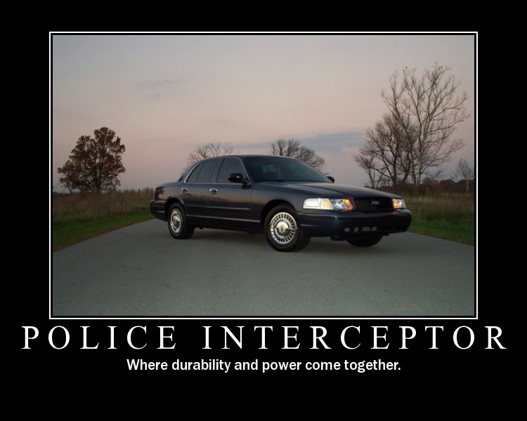 Navy Ford Crown Victoria sedan, front 3/4 view, on rural road, demotivational poster