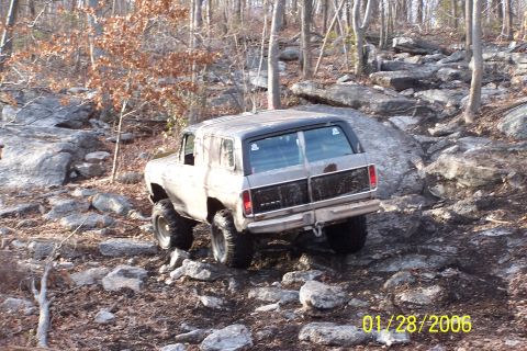 1979 Ford Bronco - This 1979 Ford Bronco tackles a challenging rocky path through a wooded area.