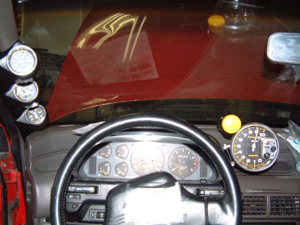 1991 Ford Probe interior with aftermarket tachometer and gauges