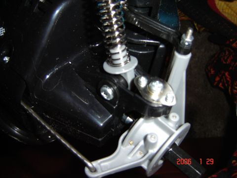 1993 Ford Bronco - Detail of a remote control car's suspension system, showing a spring and linkage components.