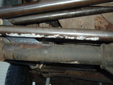 1993 Ford Bronco - Close-up view of the undercarriage, showing suspension components and exhaust system, with a Supermotors.net watermark.