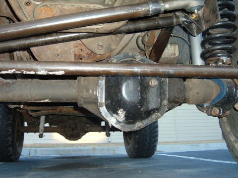 1993 Ford Bronco - Close-up of the undercarriage, focusing on the differential and suspension system.