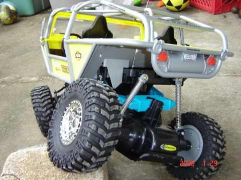 1993 Ford Bronco - This remote control toy features a roll cage and oversized tires for off-road play.