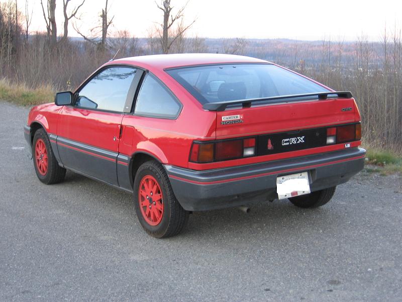 Red Honda CRX 1.5 hatchback rear three-quarter view with red alloy wheels