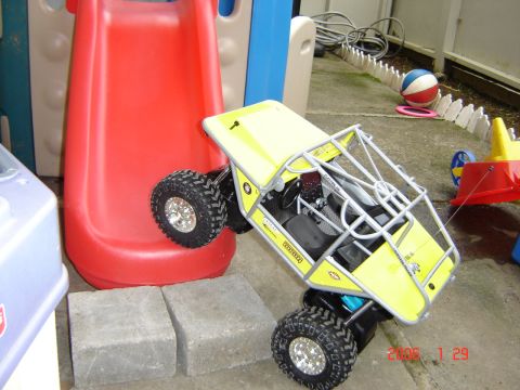 1993 Ford Bronco - This remote control vehicle is positioned on a backyard patio, near children's play equipment.