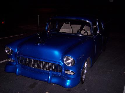 1977 Chevrolet Camaro - This modified 1955 Chevrolet sedan features a custom front bumper and grille, with a vibrant blue paint job.