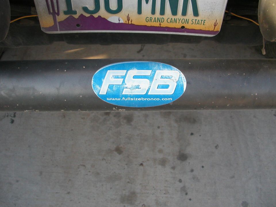 Blue oval FSB sticker with www.fullsizebronco.com on a dark bumper, Arizona license plate above