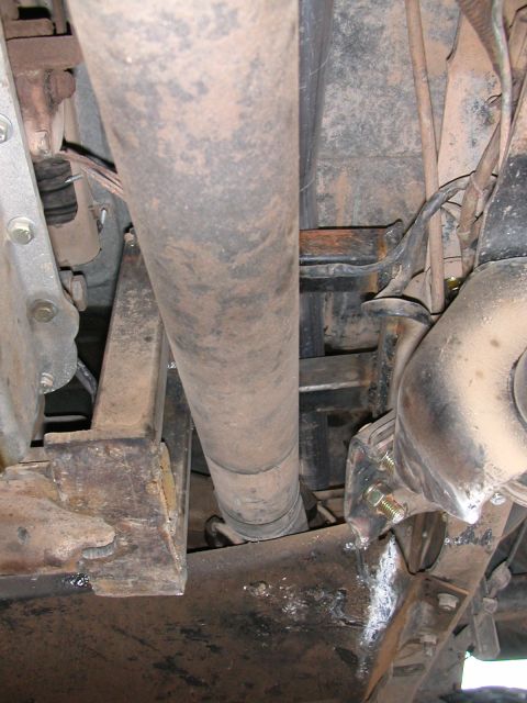 1984 Ford Bronco - Underside view showing the driveshaft and suspension components of a vehicle.