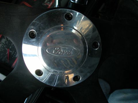 1984 Ford Bronco - The Ford logo is clearly visible on the steering wheel hub, confirming the vehicle's make.