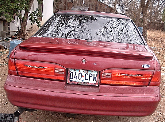 Red 1994 Ford Thunderbird rear view with Texas license plate 040-CPH