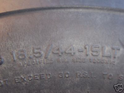 1979 Ford Bronco - Close-up of tire sidewall markings, including size and pressure information.