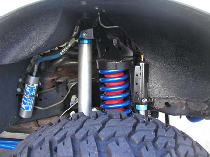 1988 Ford Bronco - Custom off-road suspension parts are visible, including a King shock absorber and a bright blue coil spring.
