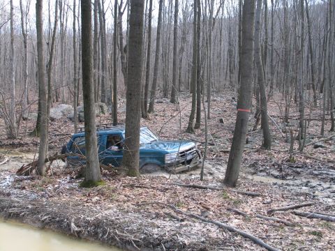 1995 Ford Bronco - This 1995 Ford Bronco is stuck in the mud while off-roading in a wooded area.