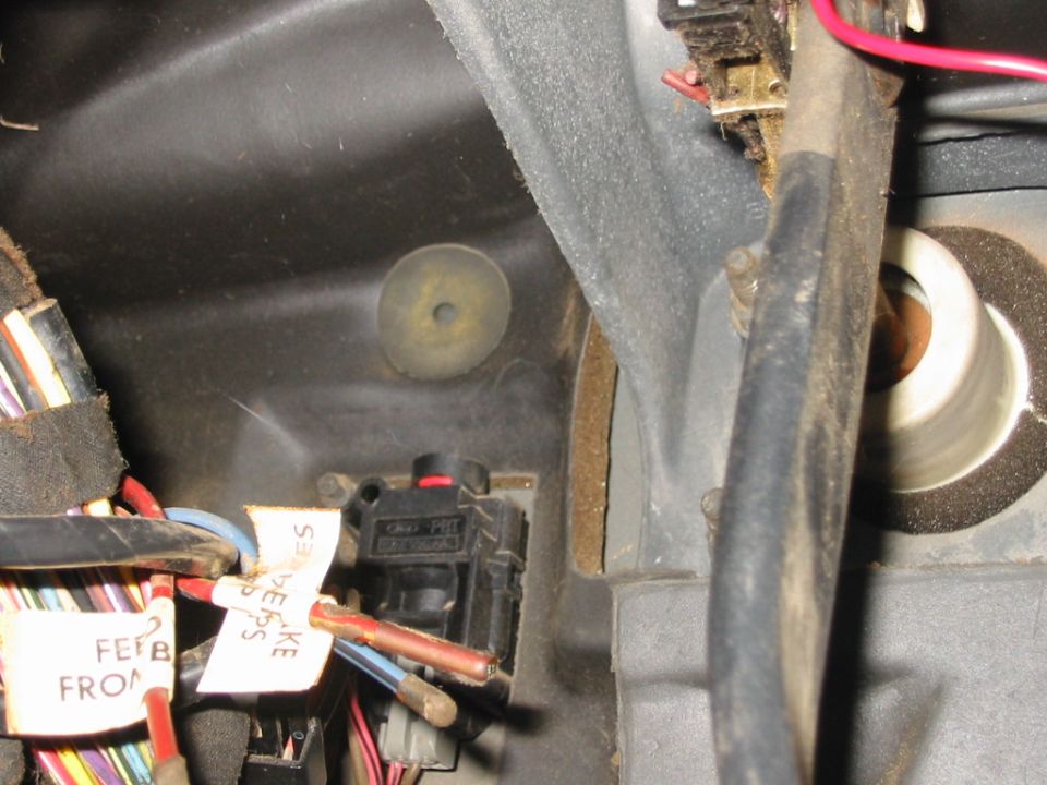 inertia switch behind emergency brake pedal