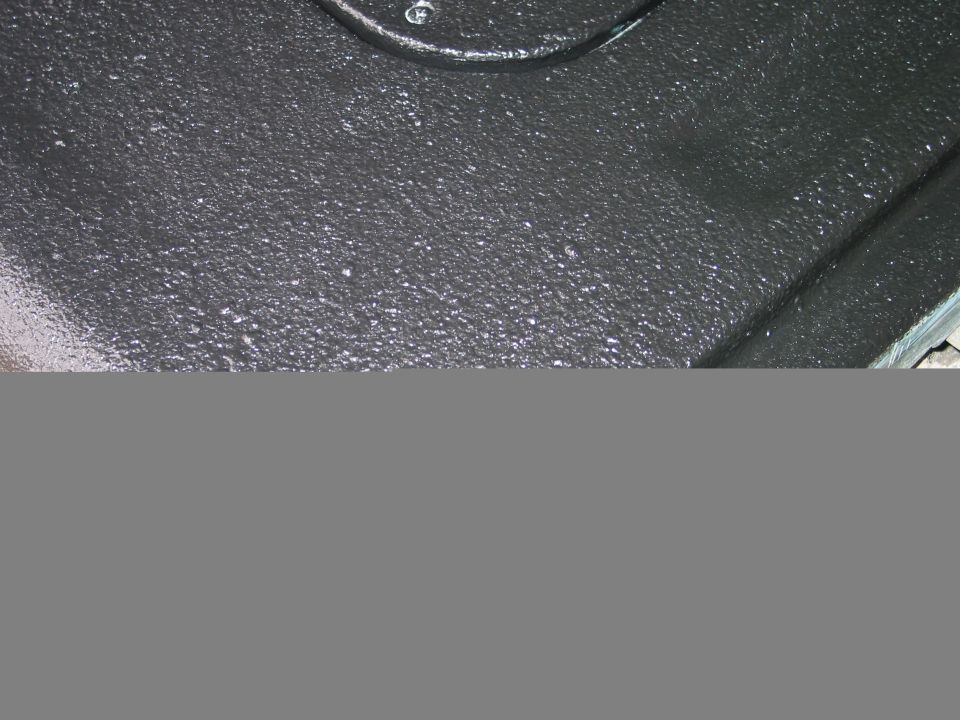 Black textured tailgate with white speckles and Supermotors.net logo
