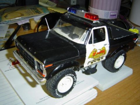 1979 Ford Bronco - Model of a 1979 Ford Bronco in police livery, a light bar and "Police" text on the door.