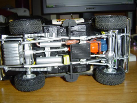 1979 Ford Bronco - Detailed underside view of a model vehicle, its chassis, engine, and suspension components.