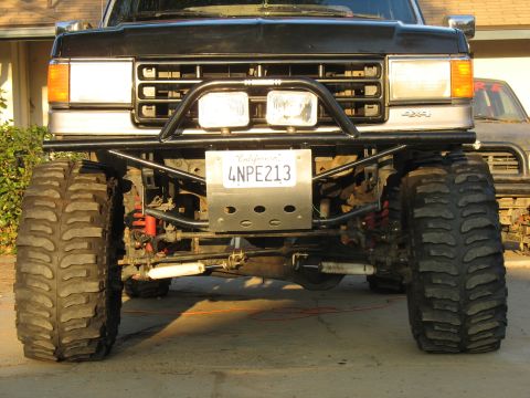 1987 Ford Bronco - This heavily modified 1987 Ford Bronco features a custom front bumper and massive off-road tires.
