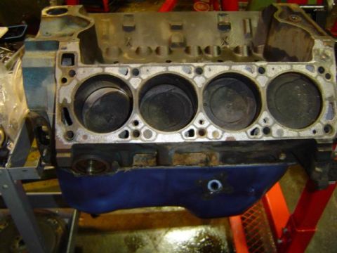 1979 Ford Bronco - Close-up view of an engine block with pistons, likely undergoing repair or rebuild.